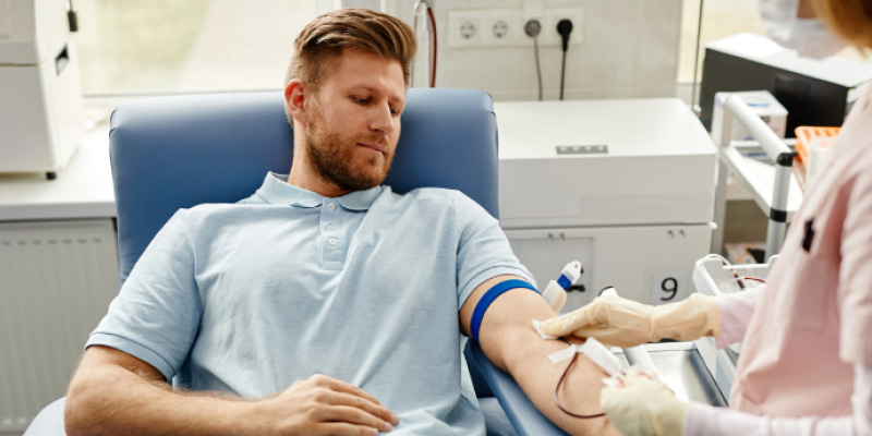 Man donating blood at a medical clinic